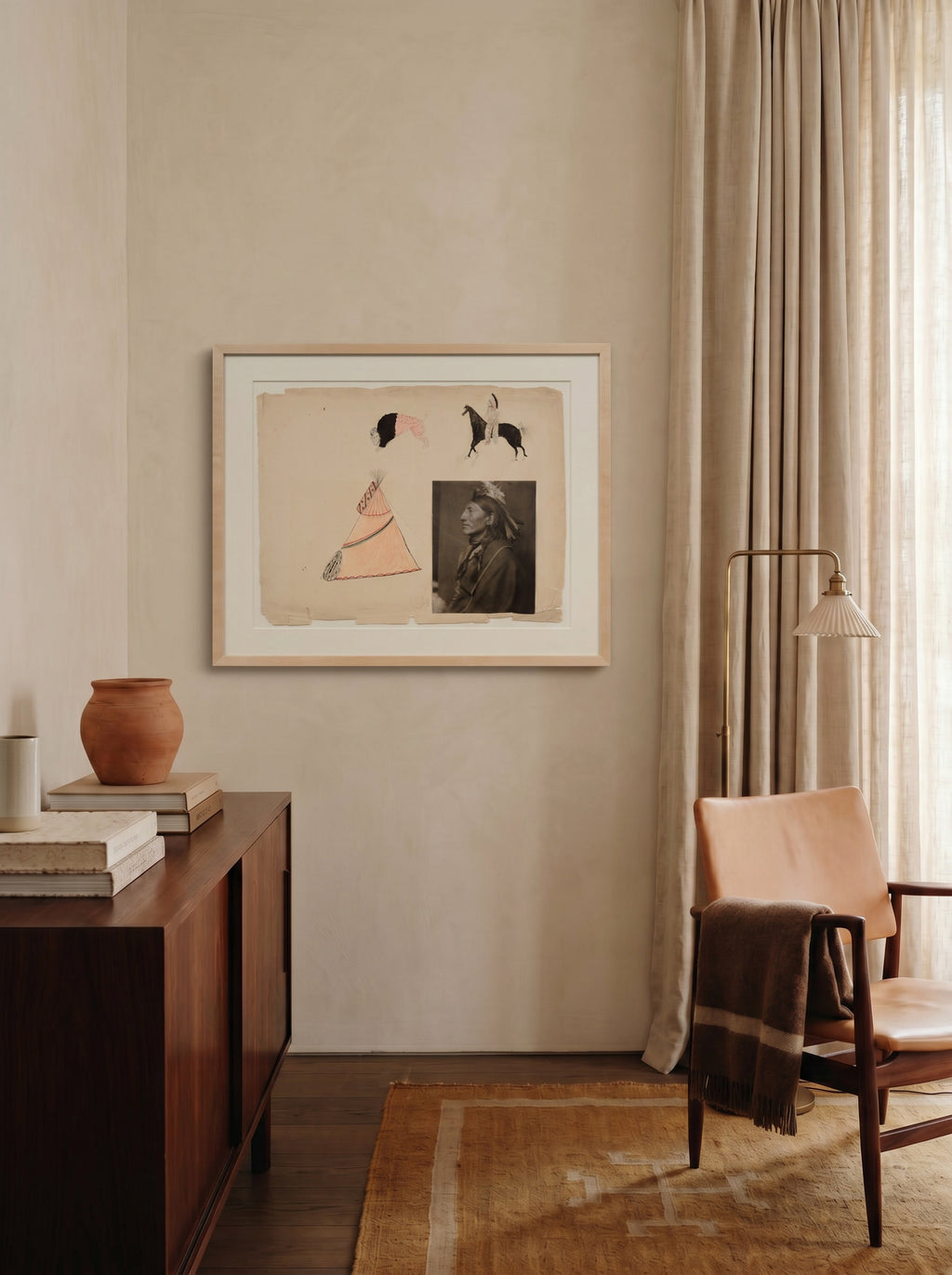 Ledger framed archival print by Life Without above a rosewood credenza in a warm neutral living room