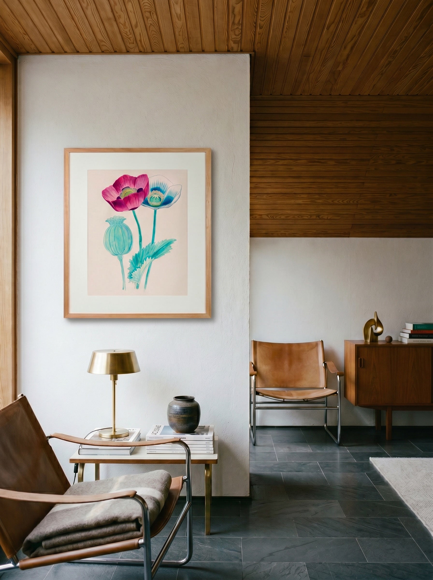 Opium Poppy framed botanical print by Life Without hanging in a mid-century sitting room with leather sling chairs